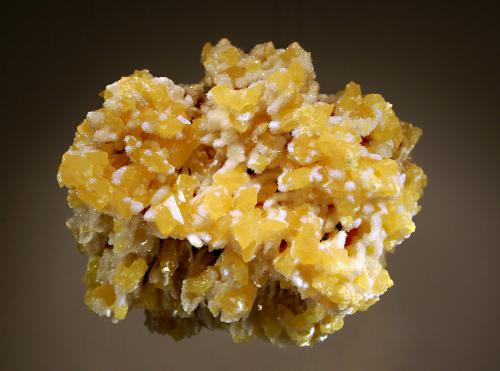 Sulfur
Cianciana Mine, Agrigento Prov., Sicily, Italy
9.2 x 10.5 cm
Yellow prismatic sulfur crystals to 1.2 cm interspersed among stalactitic growths of acicular aragonite. (Author: crosstimber)