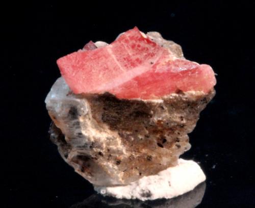 Nambulite, Gypsum
Kombat Mine, Kombat, Grootfontein District, Otjozondjupa Region, Namibia
1.0 x 1.0 x 0.7 cm
ex Chris Stefano
Partial tabular pink-red translucent crystal of nambulite on gypsum. (Author: Don Lum)