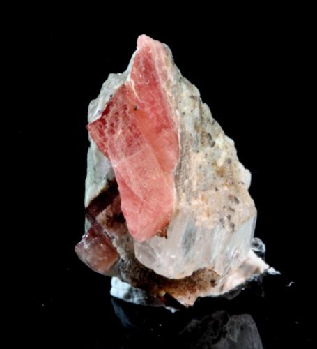 Nambulite, Gypsum
Kombat Mine, Kombat, Grootfontein District, Otjozondjupa Region, Namibia
1.0 x 1.0 x 0.7 cm
ex Chris Stefano
Partial tabular pink-red translucent crystal of nambulite on gypsum. (Author: Don Lum)