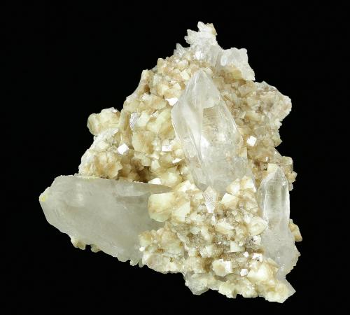 Woodhouseite on Quartz
Champion Mine, White Mts., Mono County, California, USA
51 x 38 x 34 mm

Plate of clear to translucent Quartz crystals to 30 x 13 mm is covered by hundreds of lustrous, translucent, tan crystals of Woodhousite to 4.5 mm. In perfect condition. (Author: GneissWare)