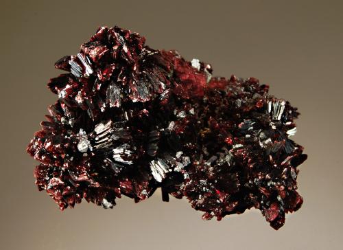 Erythrite
Aghbar Mine, Tazennakht, Bou Azzer District, Ouarzazate Prov., Morocco
4.0 x 6.0 cm
Fan-shaped groups of lustrous deep magenta erythrite crystals with small silver-gray skutterudite crystals. (Author: crosstimber)