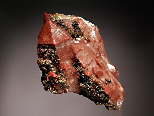 Quartz
Messina Mine, Messina, Limpopo Province, South Africa
6.0 x 7.3 cm
Doubly-terminated quartz crystals colored reddish-brown by inclusions of hematite with micro black hematite crystals coating several prism faces. (Author: crosstimber)