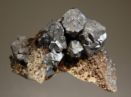 Sharply-formed, octahedral galena crystals to 2.5 cm with scattered crystals of brownish sphalerite. (Author: crosstimber)