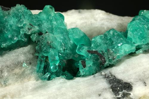 Beryl (variety emerald), Calcite<br />Coscuez mining district, Municipio San Pablo de Borbur, Western Emerald Belt, Boyacá Department, Colombia<br />Detail - FOV=5cm<br /> (Author: Fiebre Verde)