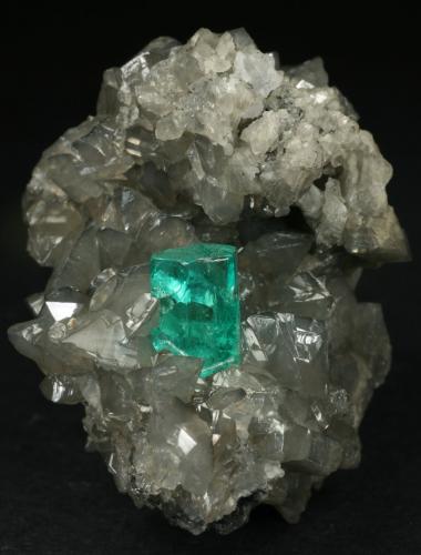 Beryl (variety emerald), Calcite<br />La Pita mining district, Municipio Maripí, Western Emerald Belt, Boyacá Department, Colombia<br />44x32x39mm  xl=9mm<br /> (Author: Fiebre Verde)