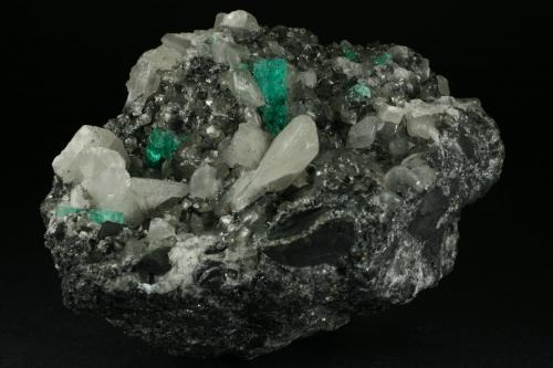 Beryl (variety emerald), Calcite<br />Coscuez mining district, Municipio San Pablo de Borbur, Western Emerald Belt, Boyacá Department, Colombia<br />95x75x75mm - main emerald xl=15mm<br /> (Author: Fiebre Verde)