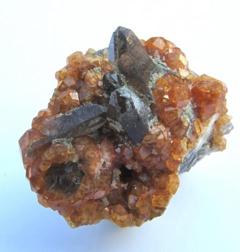 Quartz (var. smoky) and Spessartine<br />Tongbei, Yunxiao, Zhangzhou Prefecture, Fujian Province, China<br />2.4 x 1.4 cm<br /> (Author: steven calamuci)