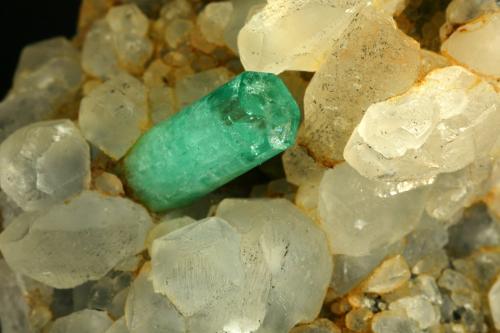 Beryl (variety emerald), Calcite<br />La Pita mining district, Polveros Mine, Municipio Maripí, Western Emerald Belt, Boyacá Department, Colombia<br />Detail - FOV=4cm<br /> (Author: Fiebre Verde)