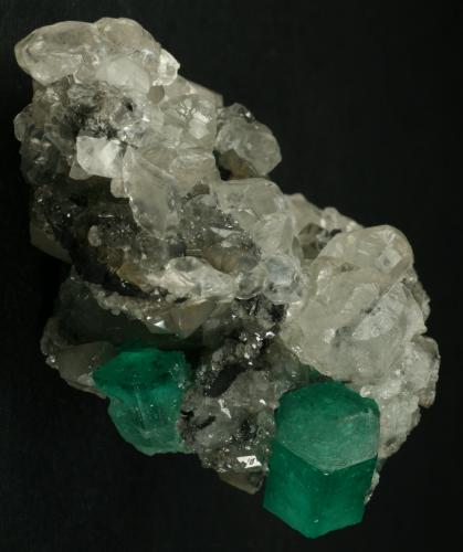 Beryl (variety emerald), Calcite<br />La Pita mining district, Cunas Mine, Municipio Maripí, Western Emerald Belt, Boyacá Department, Colombia<br />60x50x35mm<br /> (Author: Fiebre Verde)