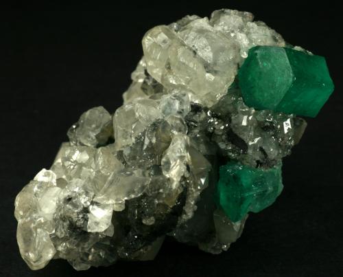 Beryl (variety emerald), Calcite<br />La Pita mining district, Cunas Mine, Municipio Maripí, Western Emerald Belt, Boyacá Department, Colombia<br />60x50x35mm<br /> (Author: Fiebre Verde)