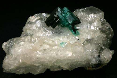 Beryl (variety emerald), Calcite<br />Muzo mining district, Western Emerald Belt, Boyacá Department, Colombia<br />60x45x28mm<br /> (Author: Fiebre Verde)