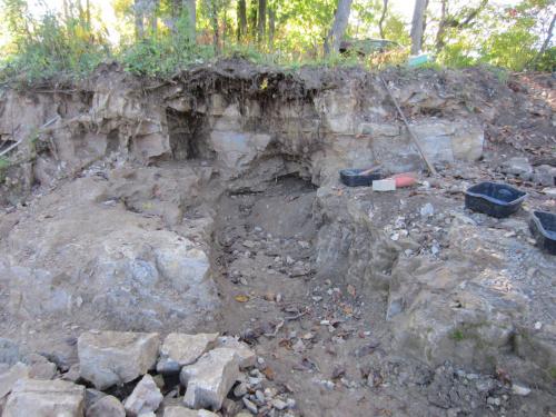 Work on the upper bench revealed a fractured zone that allowed progress into ledge. After a point we were able to put the 100 ton ram in the slot and break rock on both sides of the slot. (Author: vic rzonca)