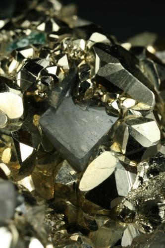 Beryl (variety emerald), Calcite and Pyrite<br />Chivor mining district, El Acuario Mine, Municipio Chivor, Eastern Emerald Belt, Boyacá Department, Colombia<br />Dolomite rhomb ~1cm<br /> (Author: Fiebre Verde)