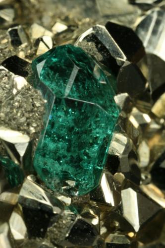 Beryl (variety emerald) and Pyrite<br />Chivor mining district, El Acuario Mine, Municipio Chivor, Eastern Emerald Belt, Boyacá Department, Colombia<br />Detail - xl length=6mm<br /> (Author: Fiebre Verde)