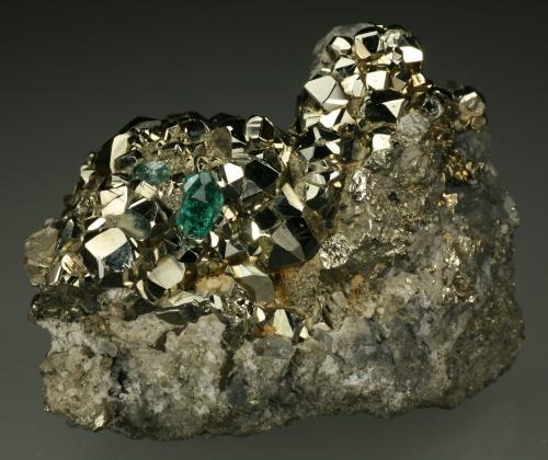 Beryl (variety emerald), Calcite, Pyrite, Dolomite<br />Chivor mining district, El Acuario Mine, Municipio Chivor, Eastern Emerald Belt, Boyacá Department, Colombia<br />60x45x55mm<br /> (Author: Fiebre Verde)