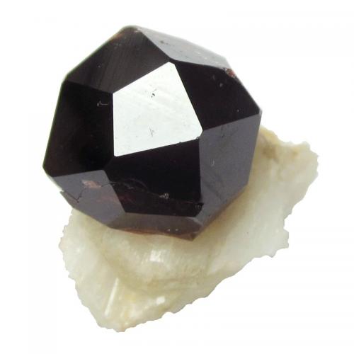 Spessartine<br />Shigar Valley, Shigar District, Gilgit-Baltistan (Northern Areas), Pakistan<br />Specimen size 2,3 cm, garnet crystal 1,5 cm<br /> (Author: Tobi)