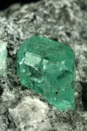 Beryl (variety emerald), Calcite, Pyrite<br />Muzo mining district, La Pava Mine, Quípama, Municipio Muzo, Western Emerald Belt, Boyacá Department, Colombia<br />xl=7mm<br /> (Author: Fiebre Verde)