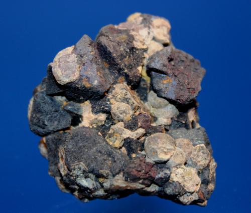 Baddeleyite, Perovskite, Anatase, Magnetite<br />Perovskite Hill, Magnet Cove, Hot Spring County, Arkansas, USA<br />5.5 x 5.0 cm<br /> (Author: Don Lum)