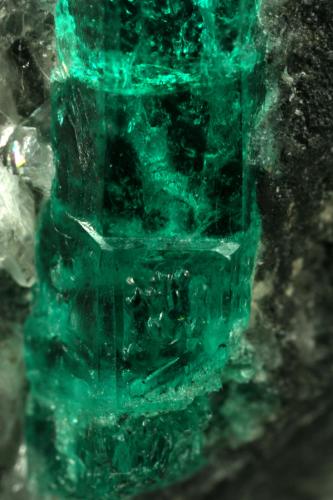 Beryl (variety emerald), Calcite<br />La Pita mining district, Municipio Maripí, Western Emerald Belt, Boyacá Department, Colombia<br />40mm across, xl=15mm<br /> (Author: Fiebre Verde)