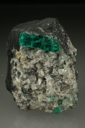 Beryl (variety emerald), Calcite<br />La Pita mining district, Municipio Maripí, Western Emerald Belt, Boyacá Department, Colombia<br />40mm across, xl=15mm<br /> (Author: Fiebre Verde)