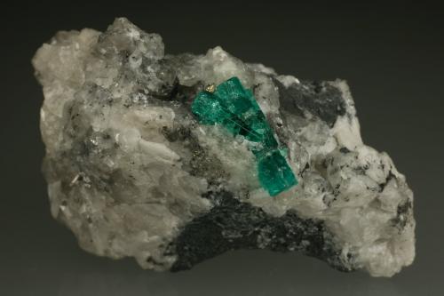 Beryl (variety emerald), Calcite, Pyrite, Quartz<br />La Pita mining district, Municipio Maripí, Western Emerald Belt, Boyacá Department, Colombia<br />60x35mm, main xl=16mm<br /> (Author: Fiebre Verde)