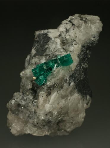 Beryl (variety emerald), Calcite, Pyrite, Quartz<br />La Pita mining district, Municipio Maripí, Western Emerald Belt, Boyacá Department, Colombia<br />60x35mm, main xl=16mm<br /> (Author: Fiebre Verde)