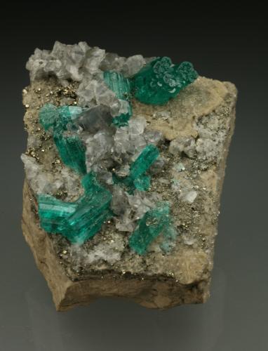 Beryl (variety emerald), Calcite, Pyrite<br />Chivor mining district, Municipio Chivor, Eastern Emerald Belt, Boyacá Department, Colombia<br />42x48x20mm<br /> (Author: Fiebre Verde)