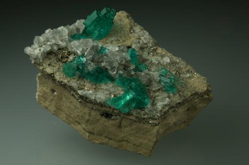 Beryl (variety emerald), Calcite, Pyrite<br />Chivor mining district, Municipio Chivor, Eastern Emerald Belt, Boyacá Department, Colombia<br />42x48x20mm<br /> (Author: Fiebre Verde)