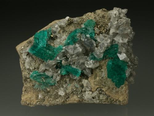 Beryl (variety emerald), Calcite, Pyrite<br />Chivor mining district, Municipio Chivor, Eastern Emerald Belt, Boyacá Department, Colombia<br />42x48x20mm<br /> (Author: Fiebre Verde)