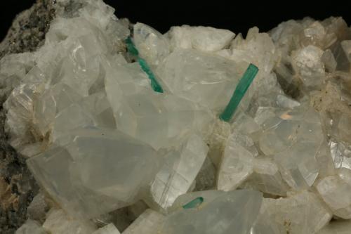 Beryl (variety emerald), Calcite, Pyrite<br />Chivor mining district, Municipio Chivor, Eastern Emerald Belt, Boyacá Department, Colombia<br />Detail - Rightmost emerald is 10mm long<br /> (Author: Fiebre Verde)