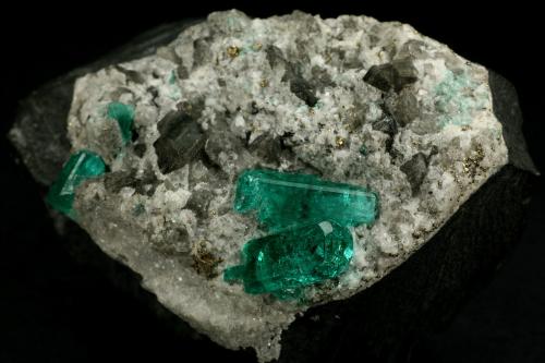 Beryl (variety emerald), Calcite, Pyrite<br />Chivor mining district, El Oriente Mine, Municipio Chivor, Eastern Emerald Belt, Boyacá Department, Colombia<br />55x35x32mm<br /> (Author: Fiebre Verde)