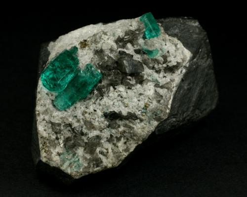 Beryl (variety emerald), Calcite, Pyrite<br />Chivor mining district, El Oriente Mine, Municipio Chivor, Eastern Emerald Belt, Boyacá Department, Colombia<br />55x35x32mm<br /> (Author: Fiebre Verde)