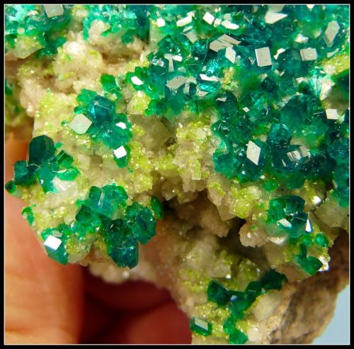 Dioptase on calcite.<br />Tsumeb Mine, Tsumeb, Otjikoto Region, Namibia<br />52 x 47 x 30 mm<br /> (Author: Pierre Joubert)