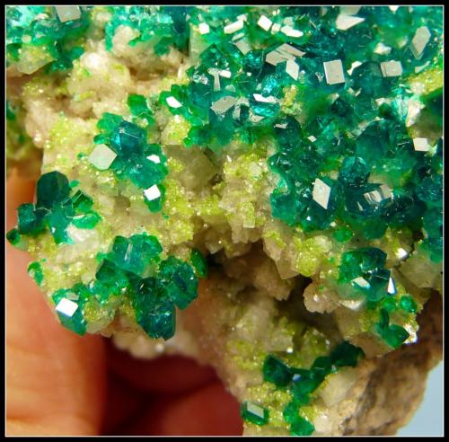 Dioptase on calcite.<br />Tsumeb Mine, Tsumeb, Otjikoto Region, Namibia<br />52 x 47 x 30 mm<br /> (Author: Pierre Joubert)