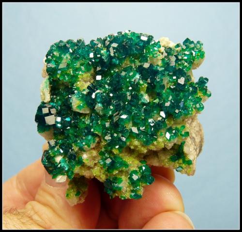 Dioptase on calcite.<br />Tsumeb Mine, Tsumeb, Otjikoto Region, Namibia<br />52 x 47 x 30 mm<br /> (Author: Pierre Joubert)