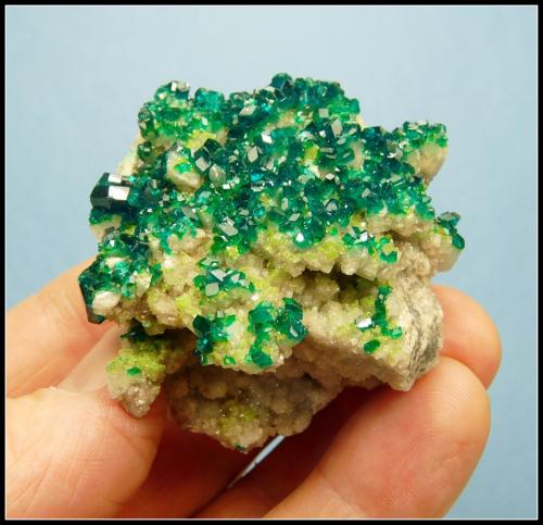 Dioptase on calcite.<br />Tsumeb Mine, Tsumeb, Otjikoto Region, Namibia<br />52 x 47 x 30 mm<br /> (Author: Pierre Joubert)