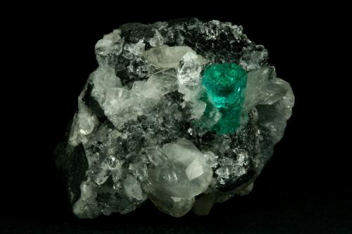 Beryl (variety emerald), Calcite, Quartz<br />Muzo mining district, Western Emerald Belt, Boyacá Department, Colombia<br />60x46x42mm, xl=13mm<br /> (Author: Fiebre Verde)