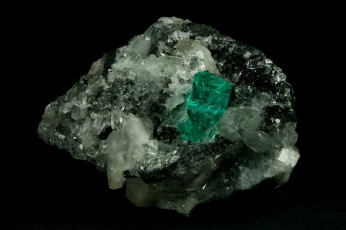 Beryl (variety emerald), Calcite, Quartz<br />Muzo mining district, Western Emerald Belt, Boyacá Department, Colombia<br />60x46x42mm, xl=13mm<br /> (Author: Fiebre Verde)