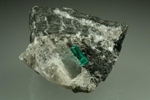 Beryl (variety emerald), Calcite, Pyrite<br />Coscuez (distrito minero), Municipio San Pablo de Borbur, Cinturón Esmeraldífero Occidental, Departamento Boyacá, Colombia<br />43x38x50mm,  xl=11mm<br /> (Author: Fiebre Verde)