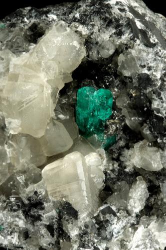 Beryl (variety emerald), Calcite<br />La Pita mining district, Municipio Maripí, Western Emerald Belt, Boyacá Department, Colombia<br />9cm across, xls=20mm<br /> (Author: Fiebre Verde)