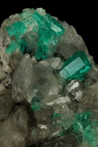 Beryl (variety emerald), Calcite, Quartz<br />La Pita mining district, Polveros Mine, Municipio Maripí, Western Emerald Belt, Boyacá Department, Colombia<br />53x51x40mm, xl=9mm<br /> (Author: Fiebre Verde)