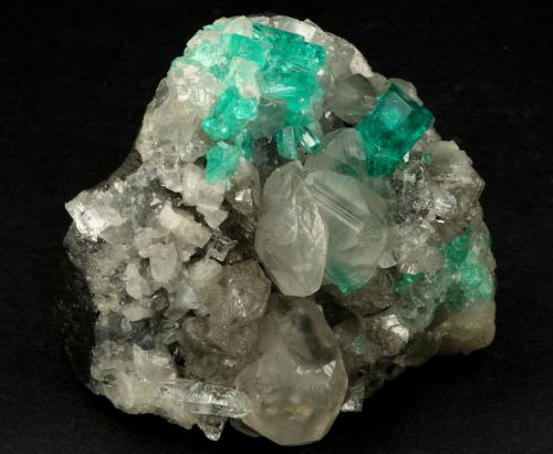 Beryl (variety emerald), Calcite, Quartz<br />La Pita mining district, Polveros Mine, Municipio Maripí, Western Emerald Belt, Boyacá Department, Colombia<br />53x51x40mm, xl=9mm<br /> (Author: Fiebre Verde)