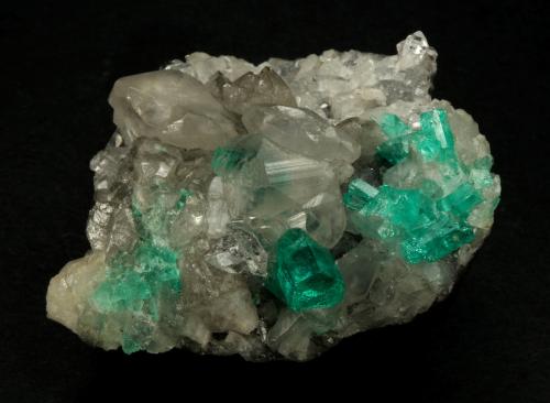 Beryl (variety emerald), Calcite, Quartz<br />La Pita (distrito minero), Mina Polveros, Municipio Maripí, Cinturón Esmeraldífero Occidental, Departamento Boyacá, Colombia<br />53x51x40mm, xl=9mm<br /> (Author: Fiebre Verde)