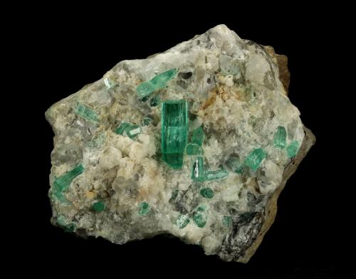 Beryl (variety emerald), Calcite, Aragonite<br />Chivor mining district, Municipio Chivor, Eastern Emerald Belt, Boyacá Department, Colombia<br />80x70x65mm, main xl=18mm<br /> (Author: Fiebre Verde)