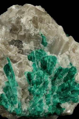 Beryl (variety emerald), Calcite<br />La Pita mining district, Municipio Maripí, Western Emerald Belt, Boyacá Department, Colombia<br />7cm across<br /> (Author: Fiebre Verde)