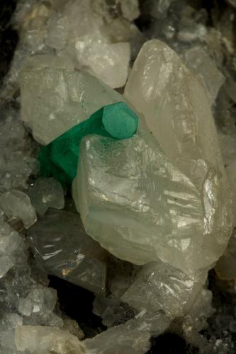 Beryl (variety emerald), Calcite<br />La Pita mining district, Polveros Mine, Municipio Maripí, Western Emerald Belt, Boyacá Department, Colombia<br />90x60x65mm, xl=16mm<br /> (Author: Fiebre Verde)