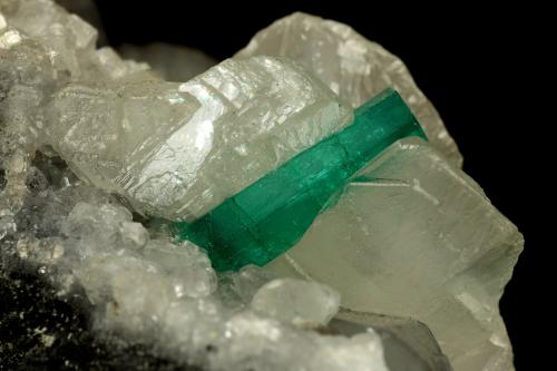 Beryl (variety emerald), Calcite<br />La Pita mining district, Polveros Mine, Municipio Maripí, Western Emerald Belt, Boyacá Department, Colombia<br />90x60x65mm, xl=16mm<br /> (Author: Fiebre Verde)