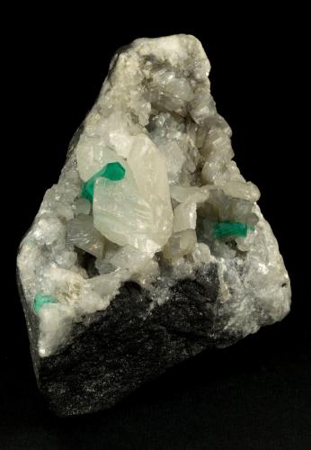 Beryl (variety emerald), Calcite<br />La Pita mining district, Polveros Mine, Municipio Maripí, Western Emerald Belt, Boyacá Department, Colombia<br />90x60x65mm, xl=16mm<br /> (Author: Fiebre Verde)