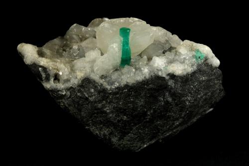 Beryl (variety emerald), Calcite<br />La Pita mining district, Polveros Mine, Municipio Maripí, Western Emerald Belt, Boyacá Department, Colombia<br />90x60x65mm, xl=16mm<br /> (Author: Fiebre Verde)