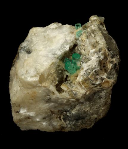 Beryl (variety emerald), Calcite, Aragonite<br />Chivor mining district, Municipio Chivor, Eastern Emerald Belt, Boyacá Department, Colombia<br />75x55x65mm, main xl~1cm<br /> (Author: Fiebre Verde)